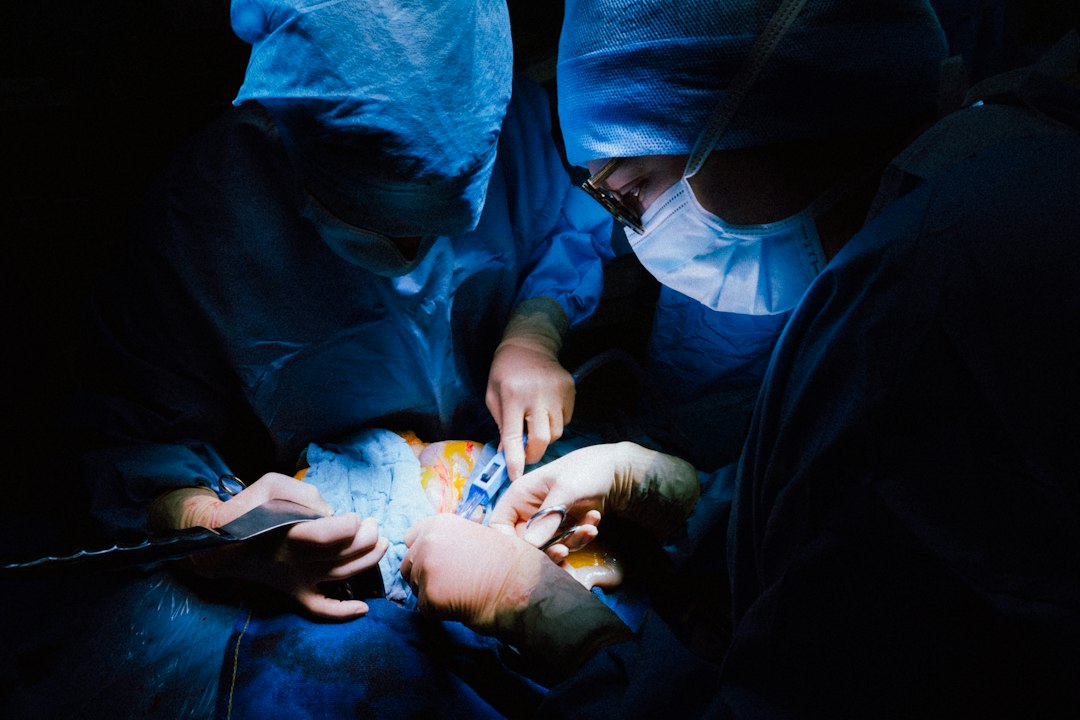 Doctors attending to a patient in a clinical setting